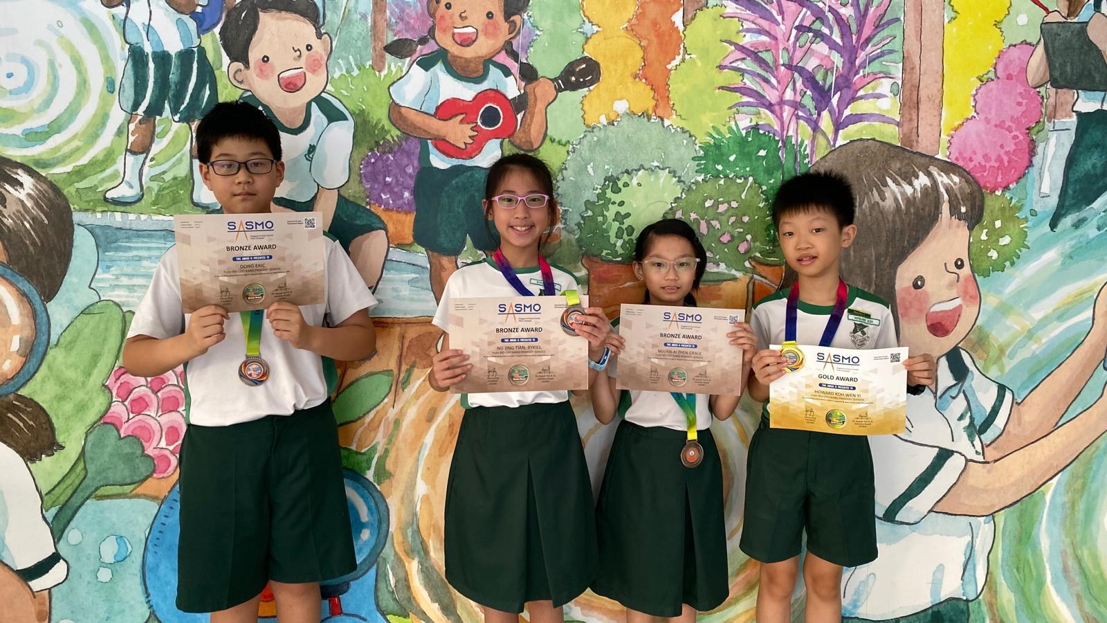 Students holding their math competition certificates